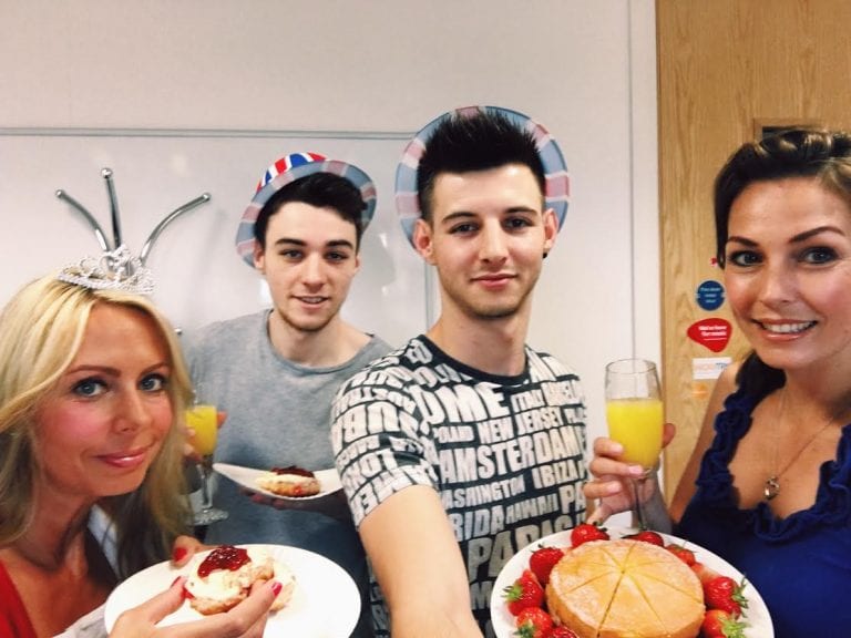 Team celebrating the queen
